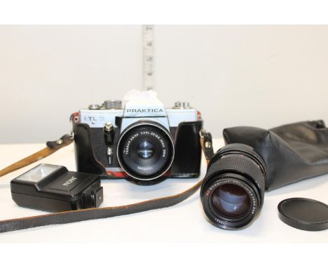 A vintage Pracktika camera with lens and accessory 