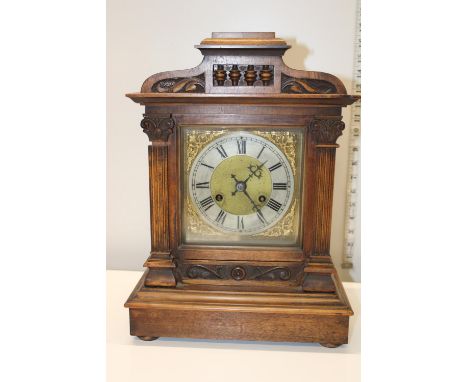 An oak cased mantle clock Postage unavailable 