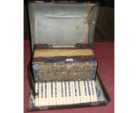 An old piano accordion in fitted carrying case