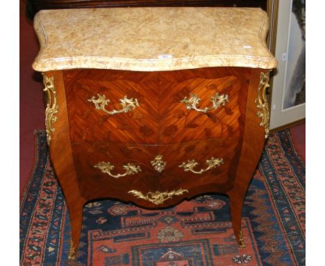 French commode chest of drawers with gilt decoration and floral marquetry to the drawer front and sides and having mottled li