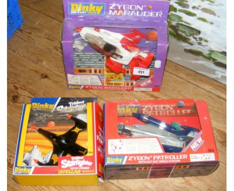 A Dinky die-cast "Trident Starfighter", together with two others