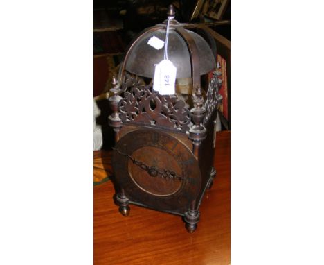 A brass lantern clock in the early style