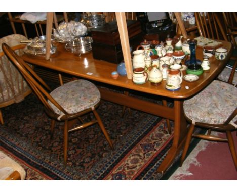 A Retro Ercol "Golden Dawn" dining table with six chairs