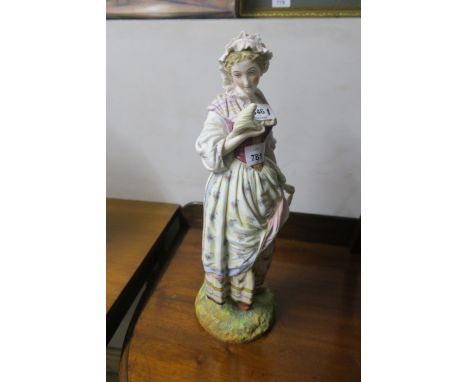 A PAINTED PORCELAIN MODEL OF A DUTCH GIRL, shown in period dress on oval base,43cms high