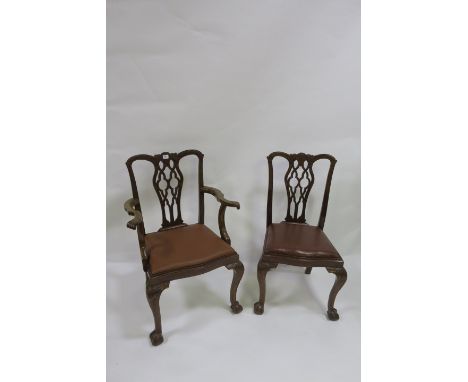A SET OF EIGHT CHIPPENDALE STYLE MAHOGANY DINING ROOM CHAIRS (including two carvers) the rectangular open backs centred by an