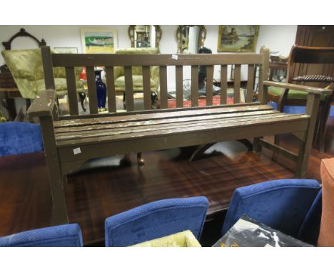 A BROWN PAINTED TEAK GARDEN BENCH