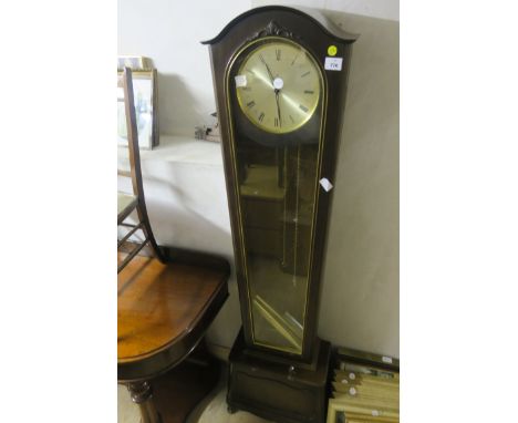 A SIMULATED MAHOGANY LONGCASE CLOCK, the silvered  dial with roman numerals enscribed, "Junghans".