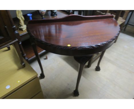 A PAIR OF CHIPPENDALE STYLE MAHOGANY SIDE TABLES each of demilune outline on cabriole legs with pad feet 82cm X 46cm