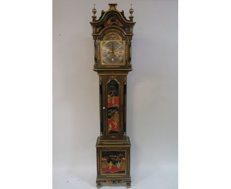 A CHINESE LACQUERED LONGCASE CLOCK, the architectural hood above a rectangular arched door containing a silver and brass dial