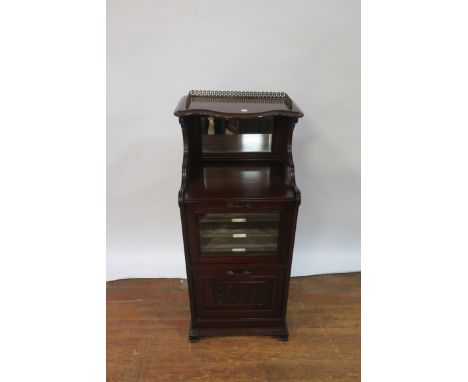 A VICTORIAN  MAHOGANY MUSIC CABINET the raised super structure of bowed outline decorated with a three-quarter pierced brass 