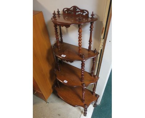 A GOOD VICTORIAN ROSEWOOD FOUR TIER WHAT NOT, each moulded shelf joined by a barley twist upright on baluster legs,132cms hig