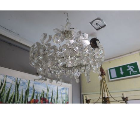 A CONTINENTAL STYLE  CUT GLASS CENTRE LIGHT, the chrome frame decorated with clustered foliates.