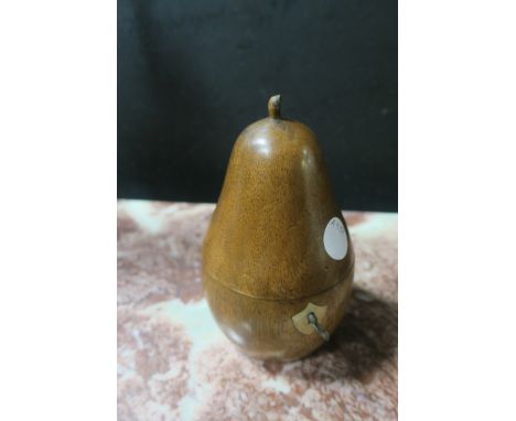 A WOODEN TURNED TEA CADDY IN THE FORM OF A PEAR, the hinged top opening to reveal a silver interior with shield shaped escutc