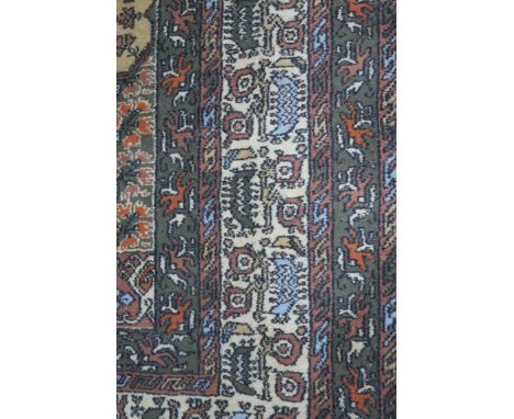 A WOOL RUG the cream light pink and grey ground with central panel within conforming borders 208cm X 122cm 