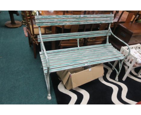 A GREEN PAINTED GARDEN BENCH