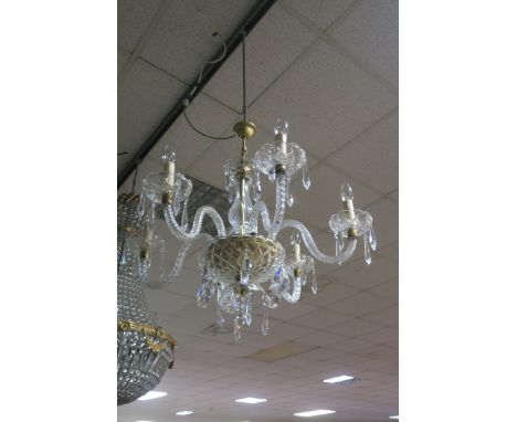 A PAIR OF CONTINENTAL STYLE CUT GLASS SIX LIGHT CHANDELIERS, the gilt brass tubular stem housed in a spiral fluted and taperi