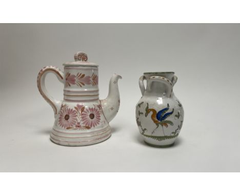 A French faience Moustiers triple handle vase of bulbous form decorated with handpainted floral motifs and a singular bird to