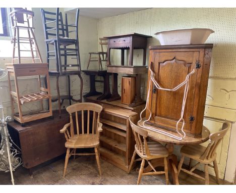 A pine dresser base, 125 cm wide, an oak drop leaf table, a rocking chair, a wine rack, a doll's high chair, six chairs, a la