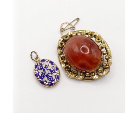 An early 20th century yellow coloured metal and amber coloured stone brooch, a yellow metal and blue enamel memorial pendant,