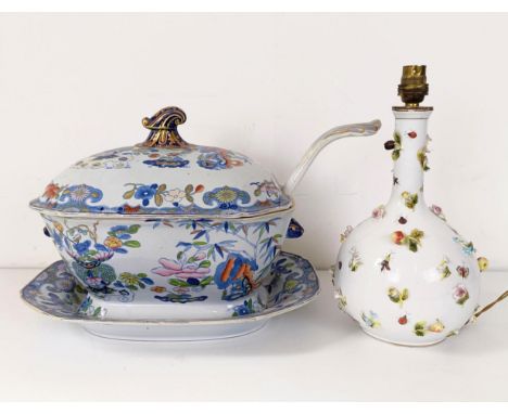 A Masons ironstone tureen and cover, on a stand with a ladle, 43 cm wide, and a lamp base, decorated flowers, 29 cm high (2) 