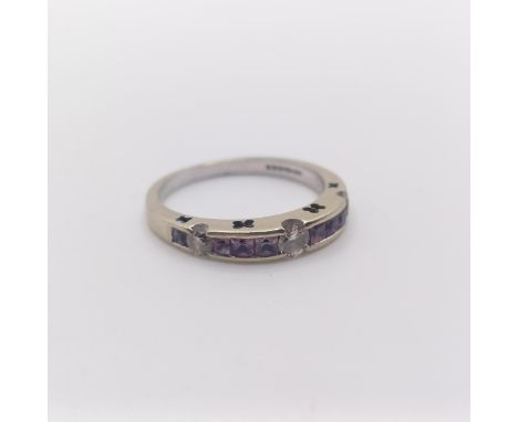 An 18ct white gold, diamond and pink stone half eternity ring, ring size L 