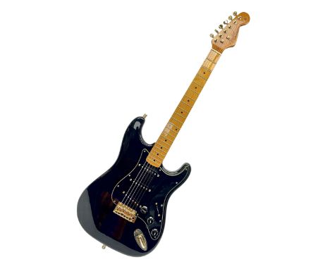 Copy of a Fender Stratocaster electric guitar in black with Wilkinson bridge, lock-in tuners, synchronised tremolo and variou
