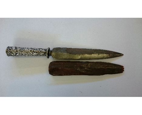 An Indian double edged dagger with Indian silver covered grip and leather scabbard.