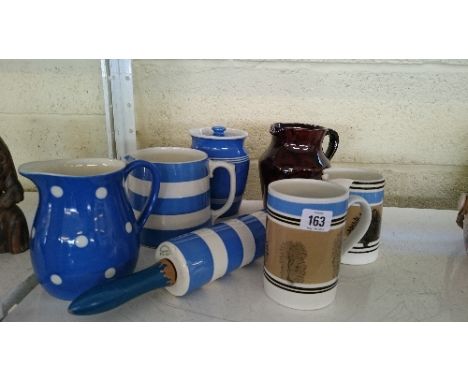 A TG Green Cornish kitchenware blue and white rolling pin together with a milk jug and other West county pottery items.