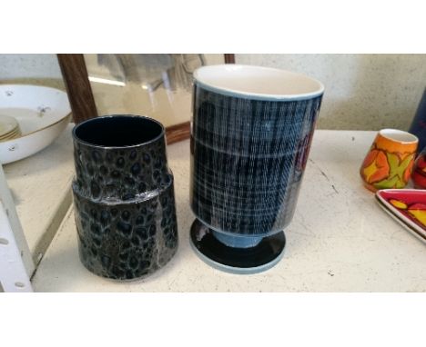 A Robert Jefferson design Poole Pottery vase, decorated in tones of blue together with another.
