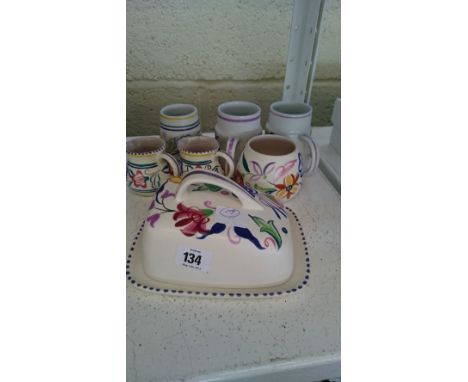 Seven various white bodied Poole Pottery items.