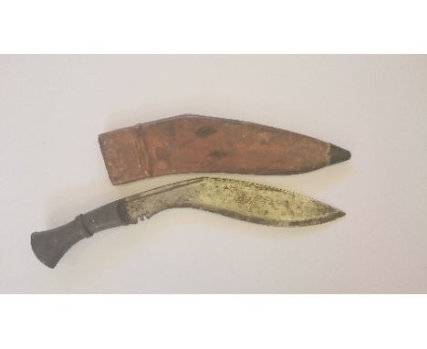 A WW1 military kukri with brass mounted leather scabbard