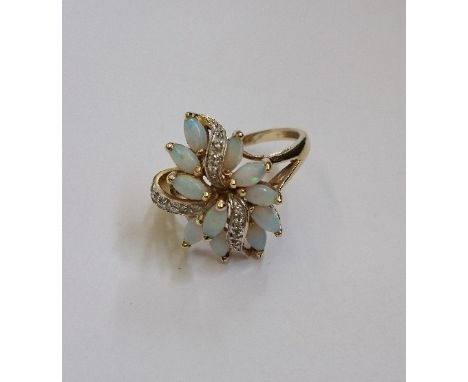 A gold coloured opal set floral ladies dress ring.