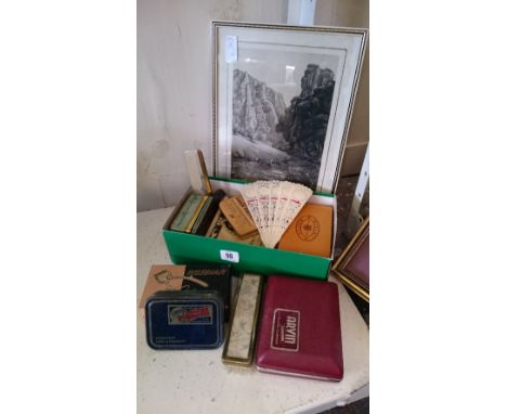 A small framed and glazed signed print together with a box of collectables including tins.