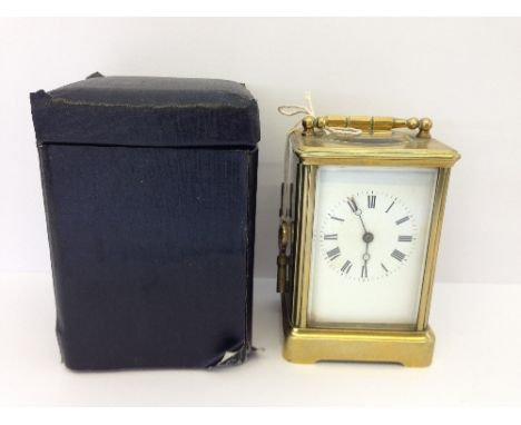 A large late 19th century brass and glass cased repeater chiming carriage clock with white dial (some discolouration) in orig