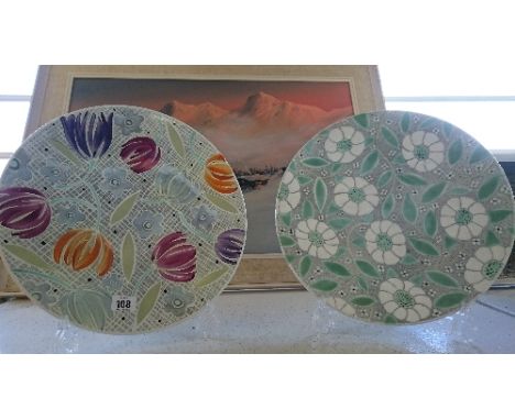 A Poole Pottery Trial dish, decorated by Ros Sommerfelt in a hand painted lustre floral pattern together with another.