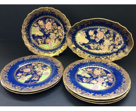 A Spode Copelands china part dessert service richly decorated in a Chinese gate and floral pattern on blue ground with gilt h