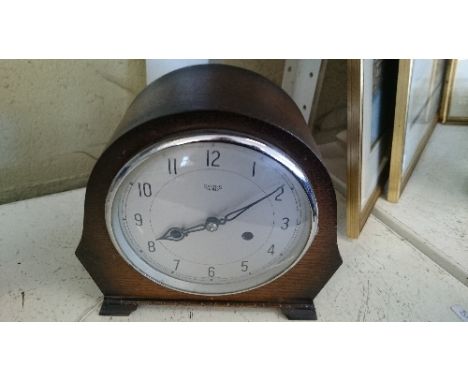 An early 20th century Smiths oak cased Art Deco chiming mantle clock.