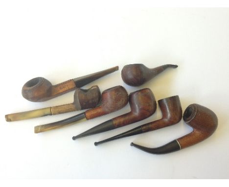 Seven various early 20th century wooden and other pipes including a Bruyere leather and horn pipe.