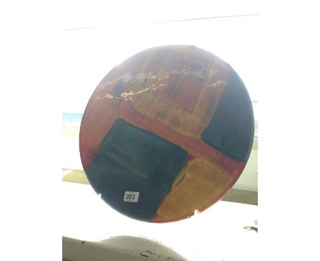 A large Poole Pottery modern charger decorated in the gemstones pattern.