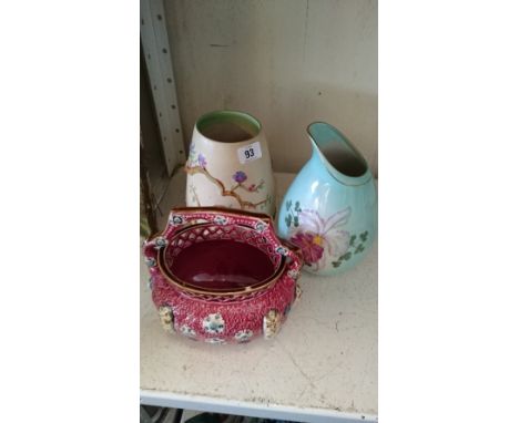 A Clarice Cliff Newport Pottery vase with tree trunk and blossom decoration in relief together with a Carlton Ware china vase