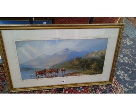 A gilt framed and glazed colour print after C Pearson and F Wainwright; Cattle by lakes edge with mountains in distance.