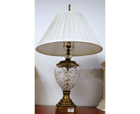 A modern cut glass and brass mounted table lamp having a pleated silk shade, height 72cm including fittings