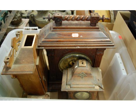 A late 19th century Continental oak cased mantel clock having a brass dial with Arabic numerals and eight day movement (for r