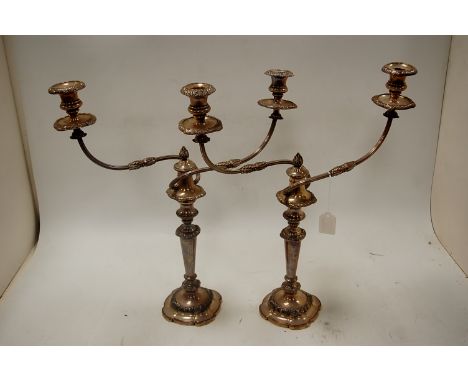 A pair of silver plated three light candelabra on loaded bases, height 52cm