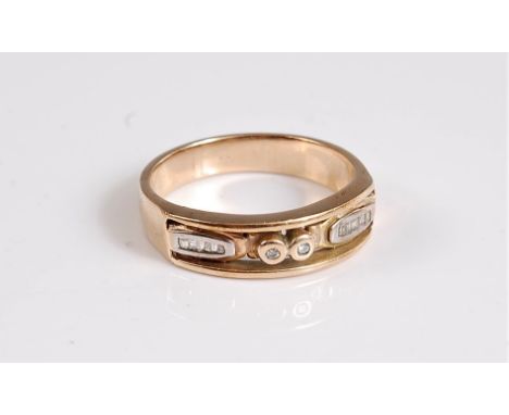 A gentleman's diamond ring, the two central collet mounted round diamonds, set within an open channel containing a small oval