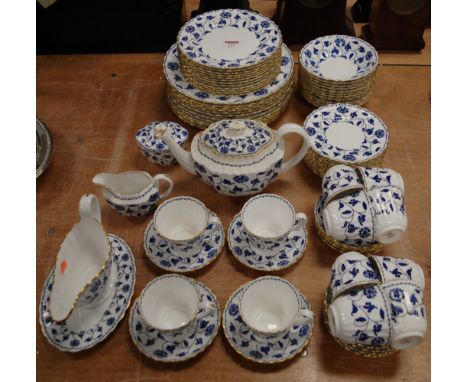 A Spode twelve place setting dinner/tea service, in the Blue Colonel pattern. Staining and discolouration to interiors of mos