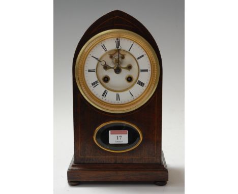 An early 20th century mahogany cased and boxwood strung mantel clock, of lancet shape, having enamelled chapter ring with Rom