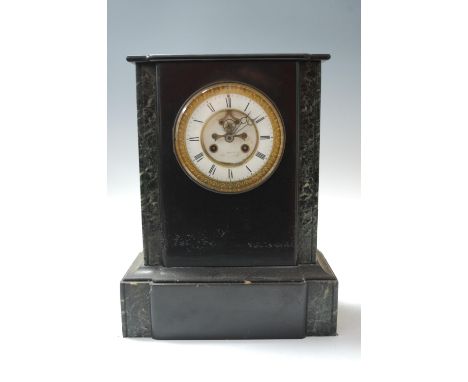 A late 19th century black slate and green marble cased clock garniture, the clock having enamelled chapter ring with Roman nu