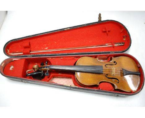 An early 20th century Continental violin, having ebony fingerboard and two-piece back, case back length 36.5cm (excluding but