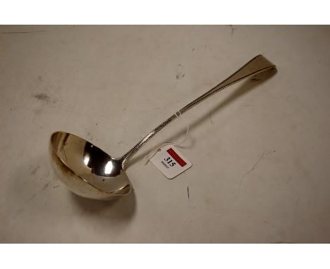 A late Georgian silver soup ladle in the beaded Old English pattern, London assays, 5.3oz, 32cm Makers mark is rubbed.Some li